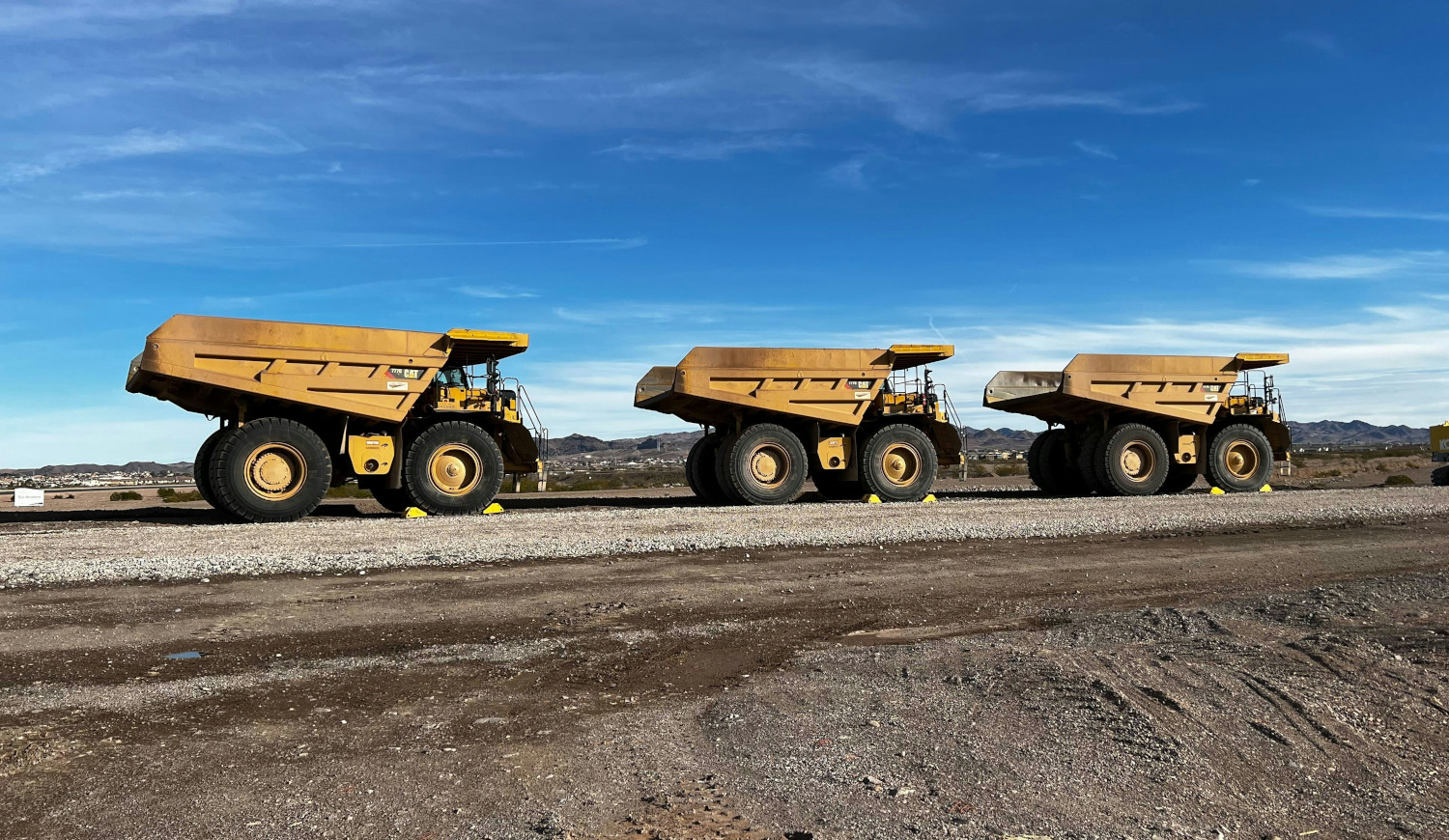 three-rock-trucks-mining-mineral-exploration